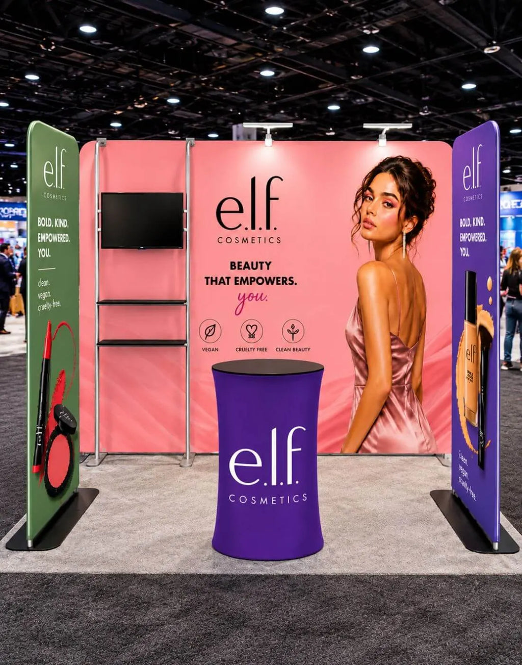booth display with TV shelf and oval counter